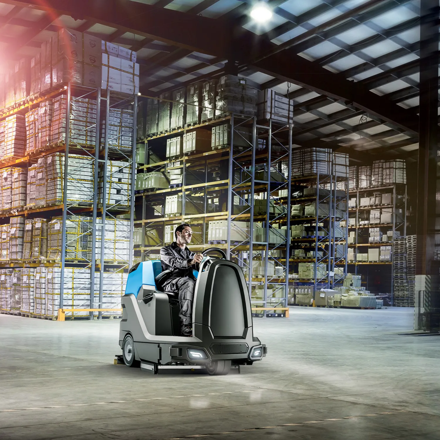 Conquest HDS90 ride-on floor scrubber delivering high-capacity cleaning performance in a large warehouse