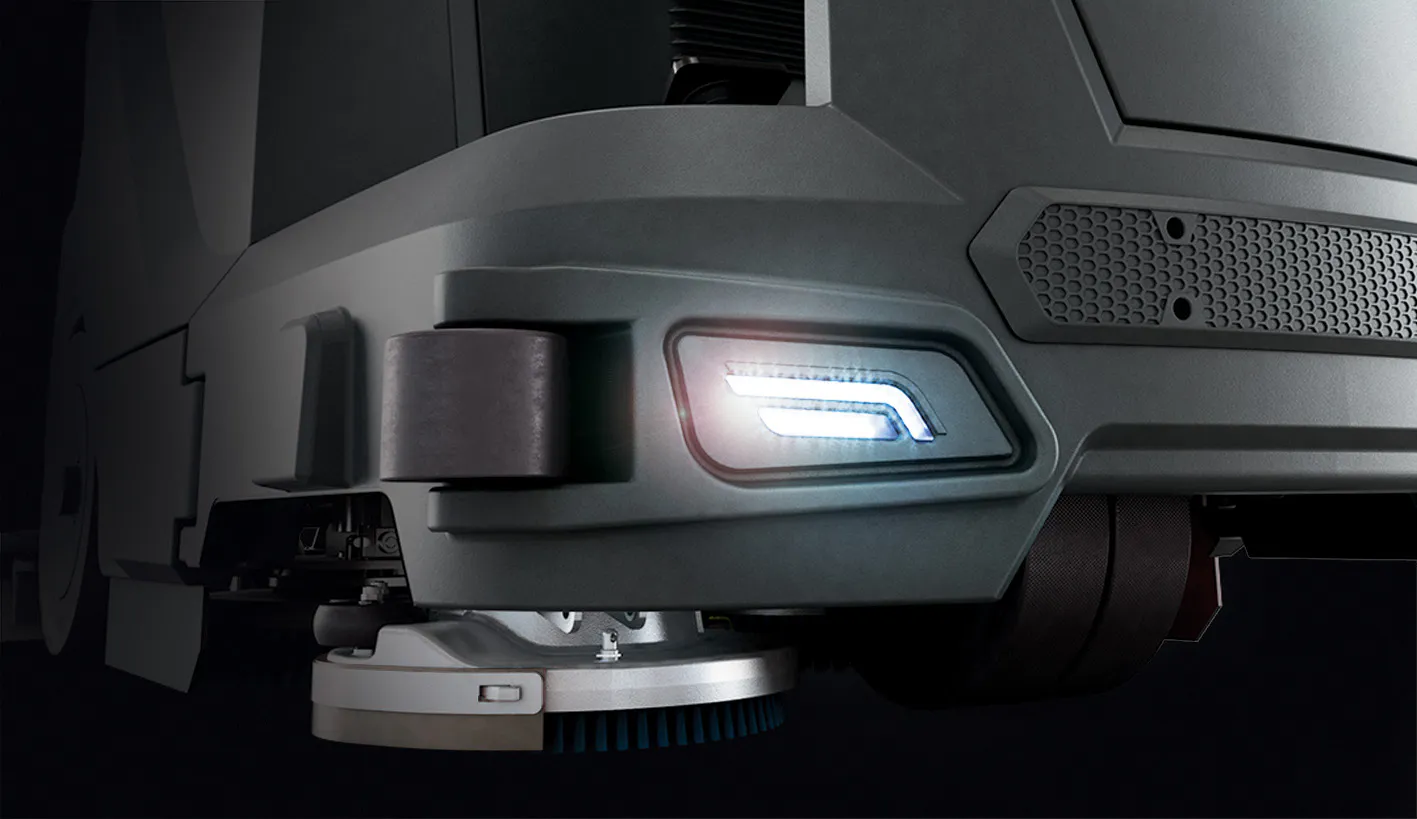 Conquest HDS90 Ride-On Industrial Scrubber with integrated LED work lights for improved visibility during commercial floor cleaning