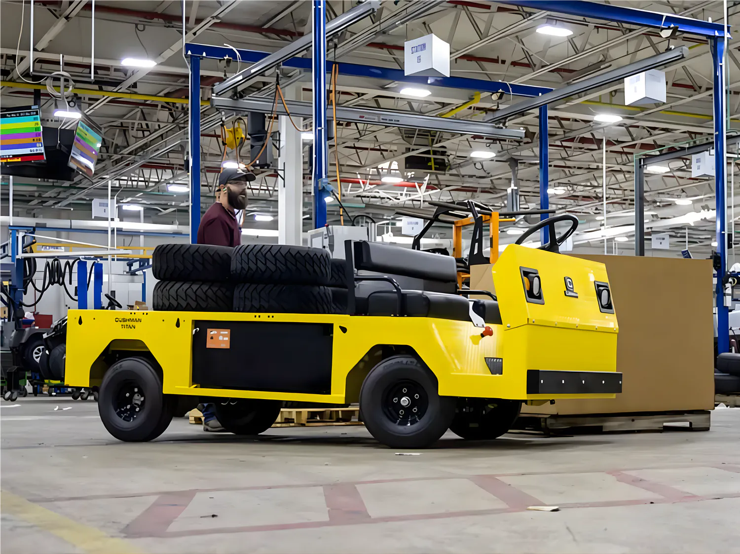 Conquest Titan XD-2 industrial vehicle carrying tyres in a warehouse for efficient material handling operations